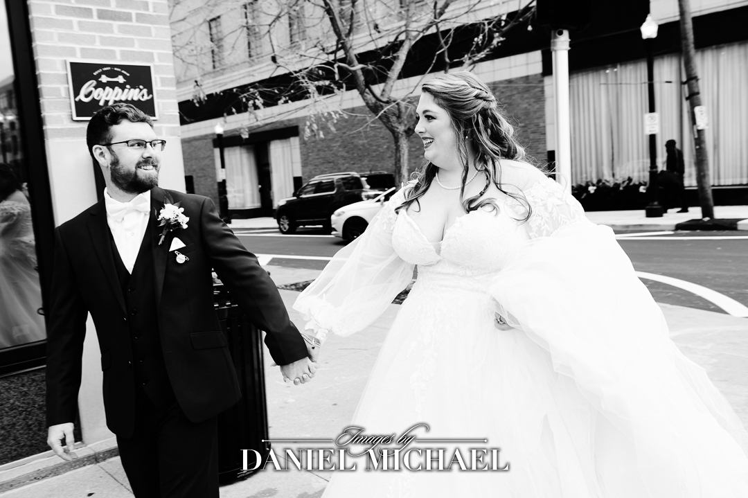Couple holding hands with black and white overlay